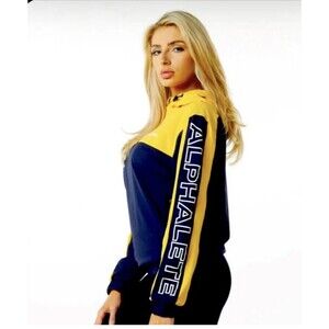 ALPHALETE Women’s EXP Tech Windbreaker- Canary Yellow, Size Large